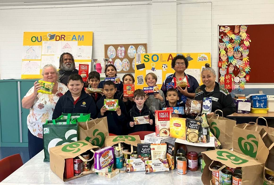 Barnardos Australia Yurungai Learning Centre accepting food drive donations from Australia Mutual Bank staff and members