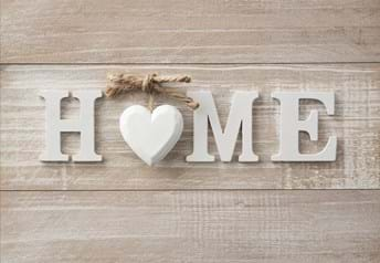 Whitewashed home sign