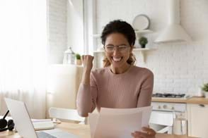 woman thrilled to reach financial goals