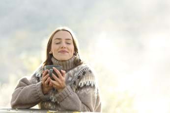 woman soaking up the sun in winter