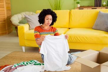 woman disappointed with cheap online clothes purchase