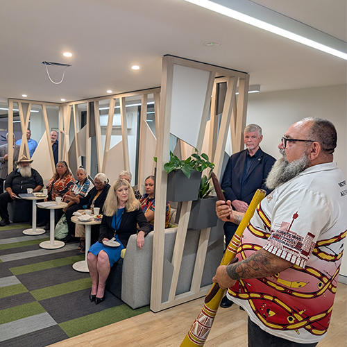 Brendan Kerin performs on a yidaki (didgeridoo) during the Welcome to Country