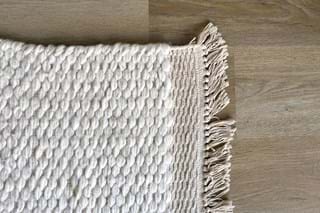 Bohemian style rug made from natural wool.